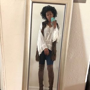 Fur vest and white sheer blouse